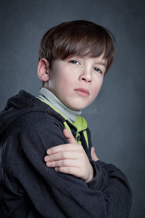 Portrait of boy on gray background royalty free stock image