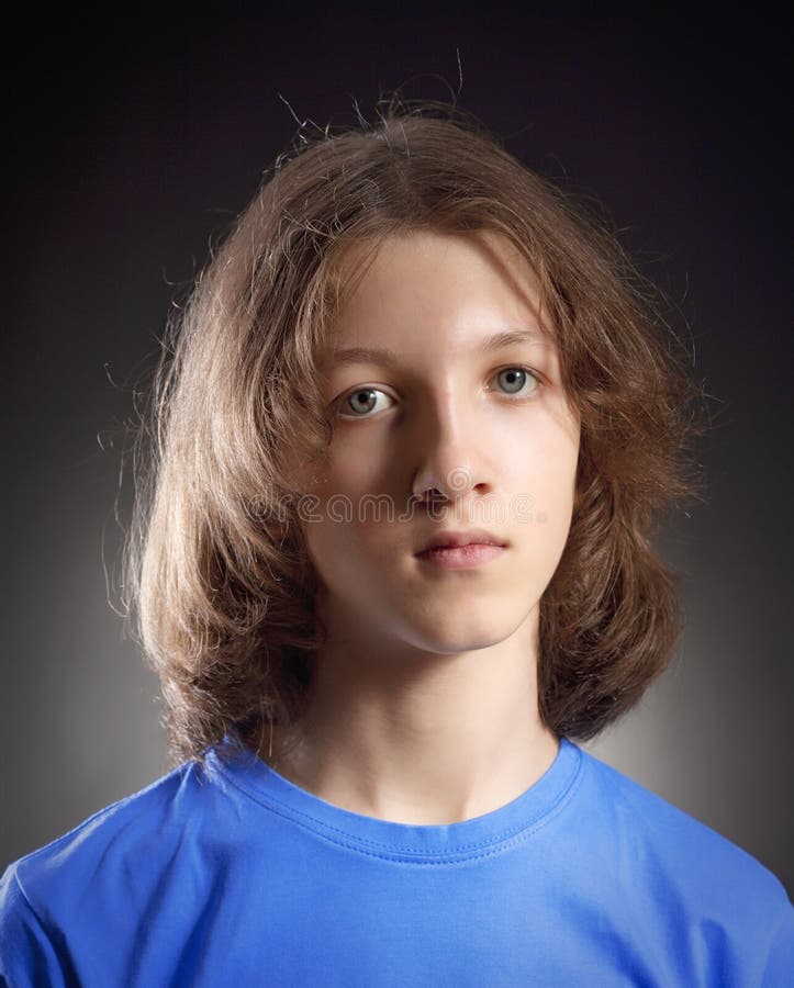 Portrait of a Boy with Long Hair in Blue Top Stock Photo - Image of brown,  childhood: 204594662