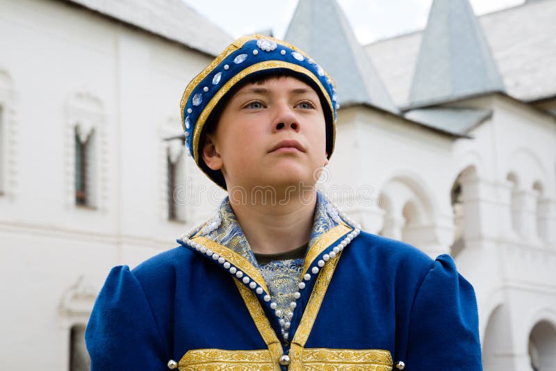 Portrait boy in national russian suit in Kremlin Rostov Great