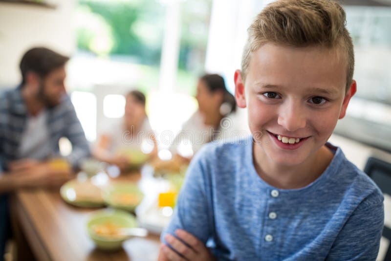 Portrait of Boy Sitting on Dining Table Stock Photo Image of casual