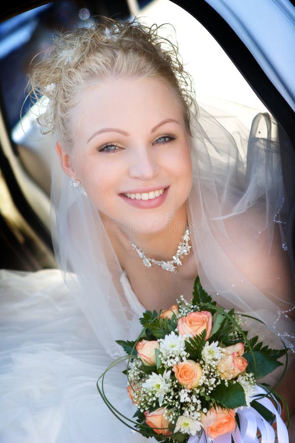 Portrait of the bride holding a bouquet