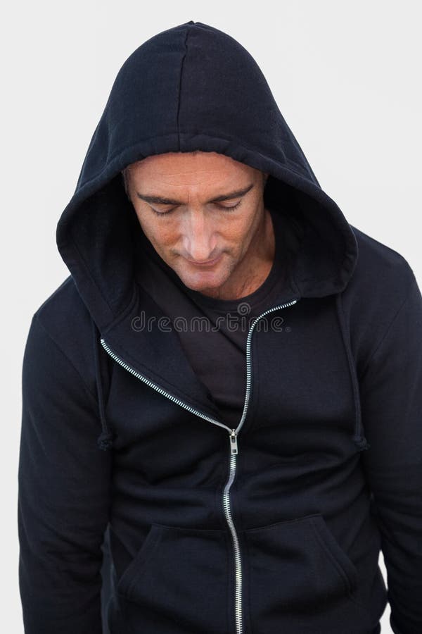 Portrait of a burglar in hood jacket stock photos Portrait of a burglar in hood jacket stock photos