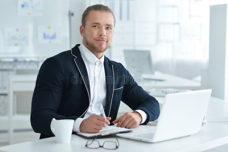 Portrait of a business man with a laptop