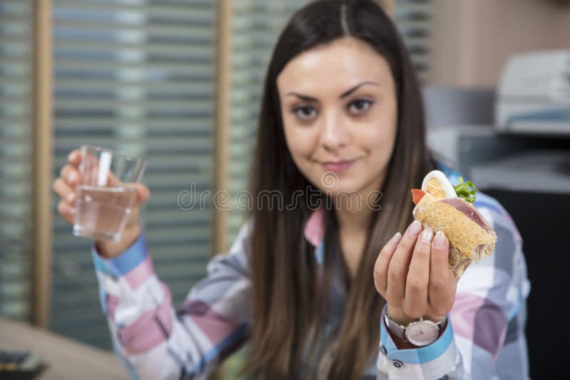 Portrait of business woman while eating lunch