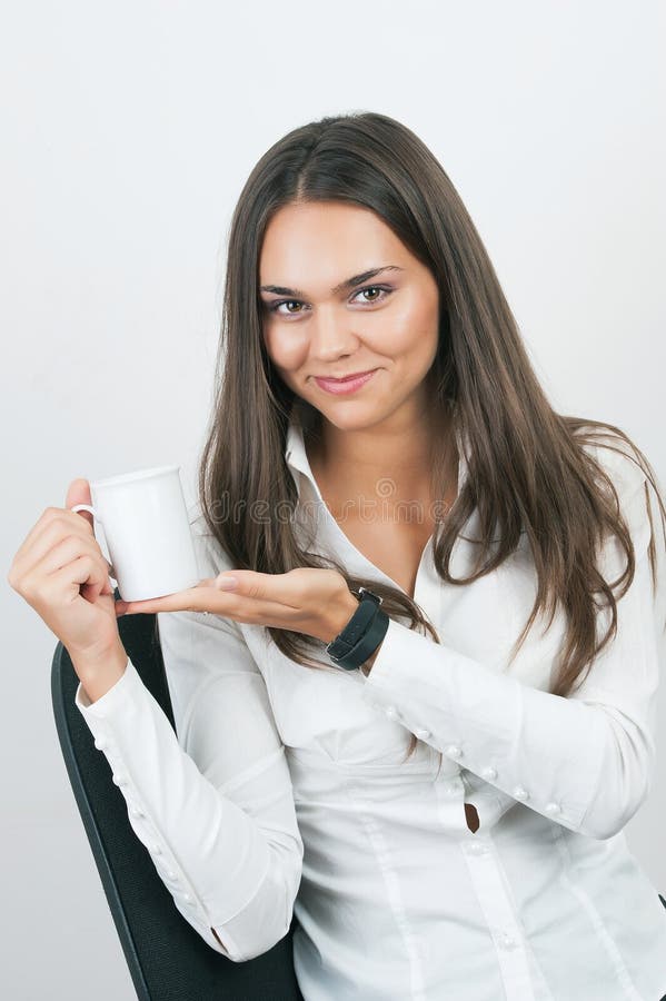 Portrait of business woman holding coffee cup