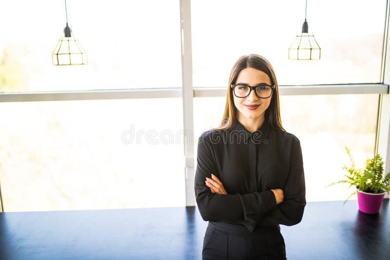 Portrait of business woman standing in modern office royalty free stock photography Portrait of business woman standing in modern office royalty free stock photography
