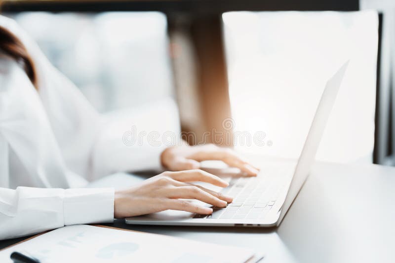 Portrait of a business woman working on a computer at work stock images