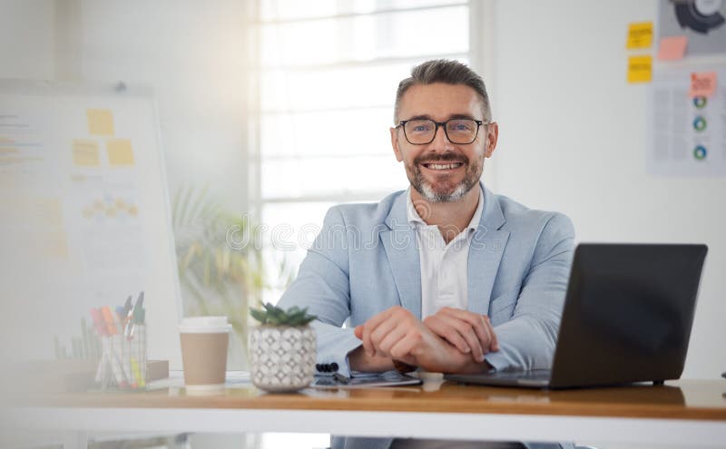 Portrait of businessman at office desk with smile, laptop and tablet on business website, online report or social media