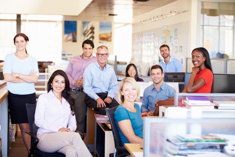Portrait Of Businesspeople In Modern Open Plan Office stock image