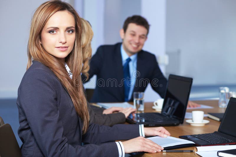 Portrait of businesswoman sitting at table