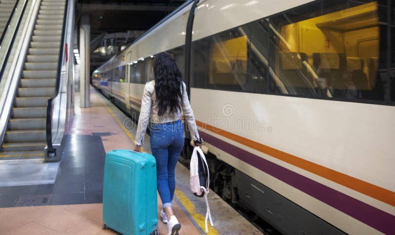 Portrait Of A Businesswoman Traveling On Foot Through A Train Station portrait-of-a-businesswoman-traveling-on-foot-through-a-train-station