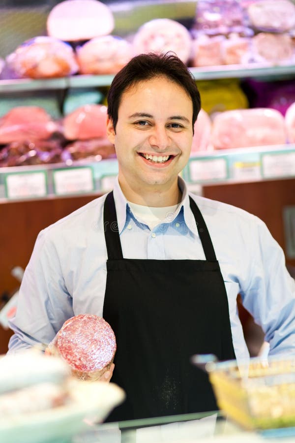 Happy worker in a grocery stock images