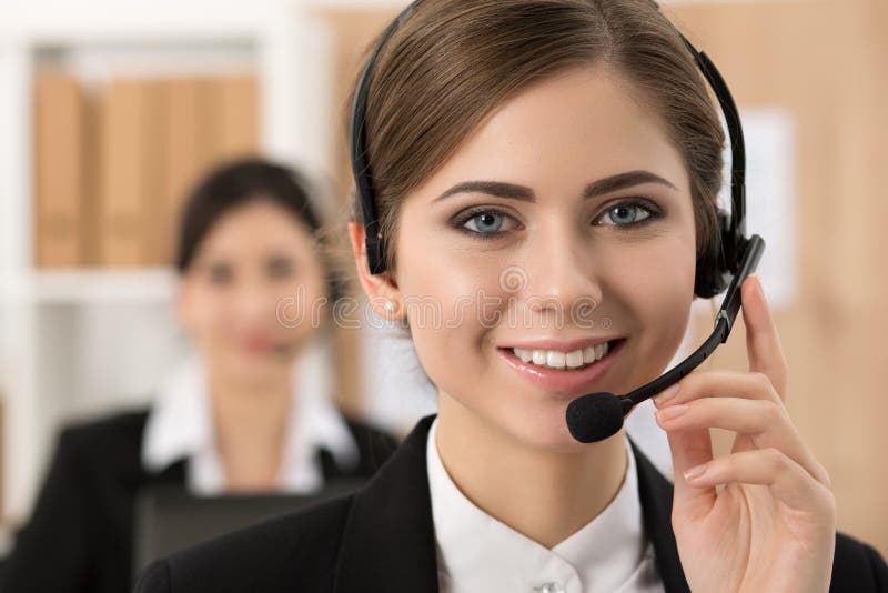 Portrait of call center worker accompanied by her team stock photography