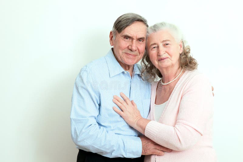 Portrait of candid senior couple enjoying their retirement. Affectionate elderly couple with beautiful beaming friendly smiles pos stock photo Portrait of candid senior couple enjoying their retirement. Affectionate elderly couple with beautiful beaming friendly smiles pos stock photo