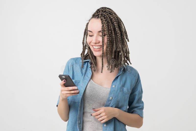 Portrait of caucasian woman with breads reading sms on phone. royalty free stock image Portrait of caucasian woman with breads reading sms on phone. royalty free stock image