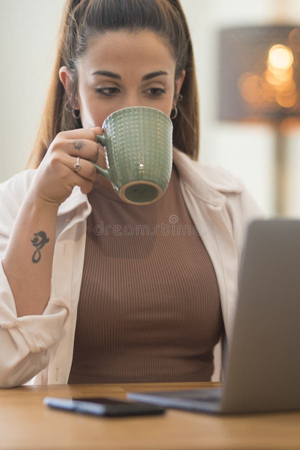 Portrait of caucasian young Woman working and typing on laptop computer keyboard - office and smart working job concept for stock image
