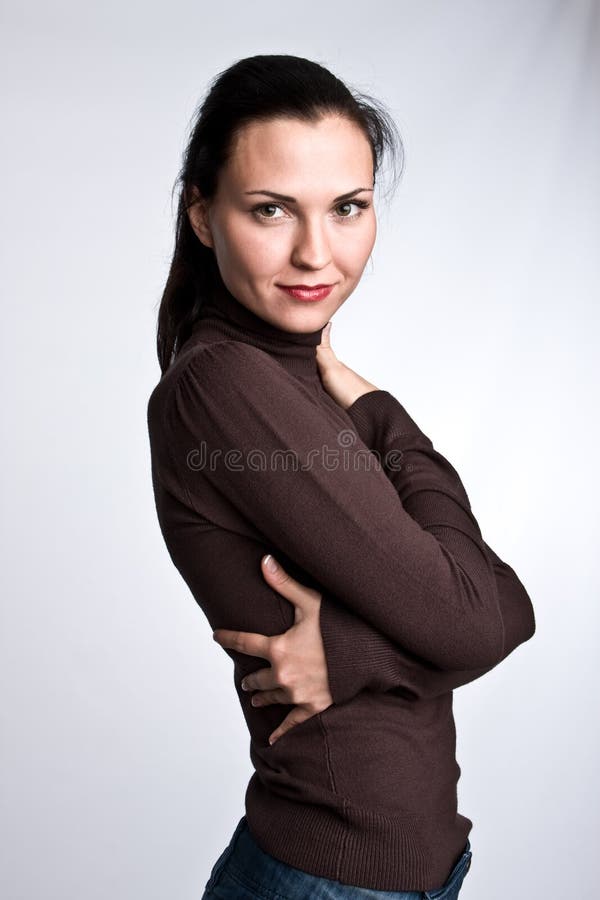 Portrait of the charming girl with dark hair on a