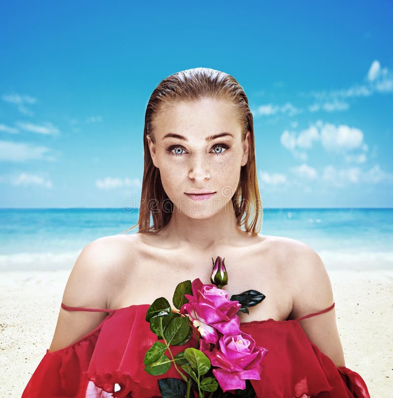 Portrait of a charming lady holding a bouquet of roses