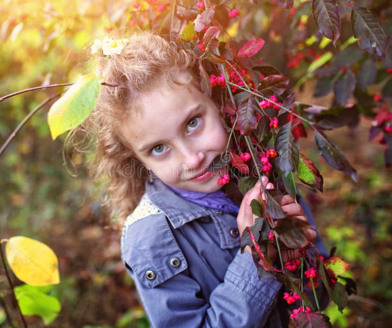 Portrait of a charming little girl in an autumn day stock images Portrait of a charming little girl in an autumn day stock images