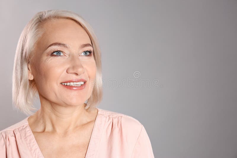 Portrait Of Charming Mature Woman With Healthy Beautiful Face Skin And