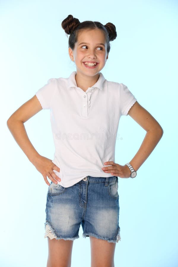 Portrait of a Little Girl 12 Years Old Smiling, she is in a Blue Denim  Shorts Stock Image - Image of hair, face: 112463335