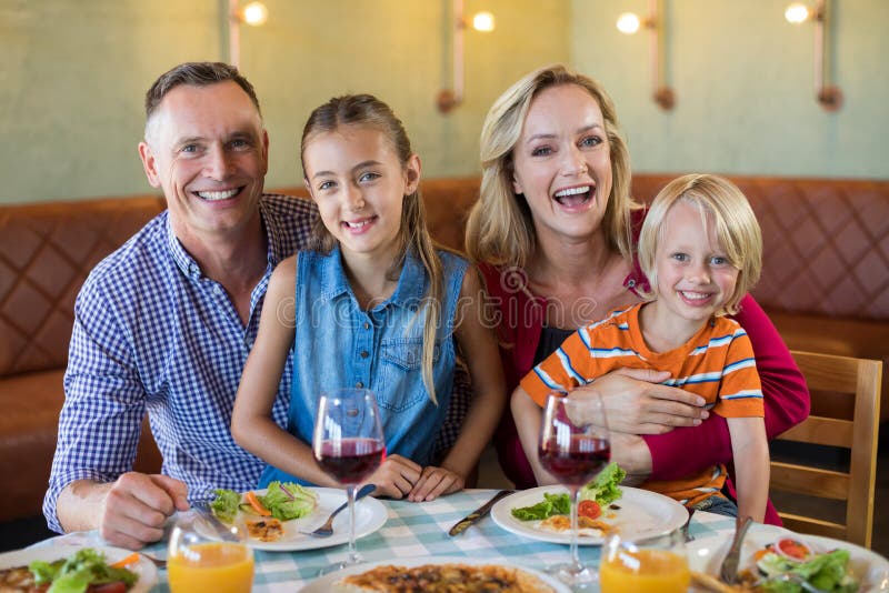Portrait of cheerful family at restaurant stock images Portrait of cheerful family at restaurant stock images