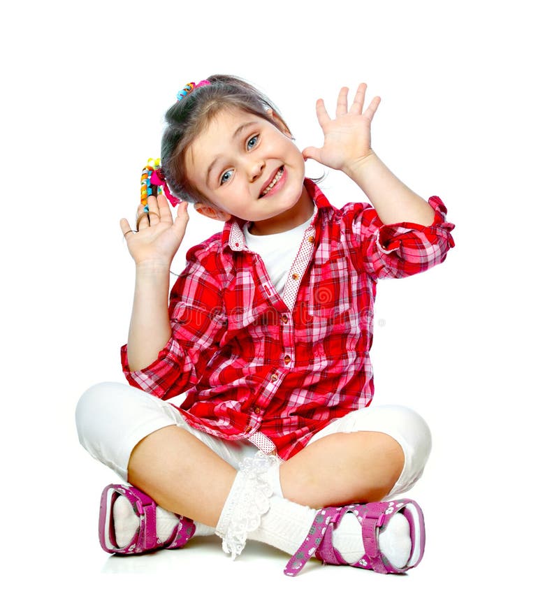Portrait of a cheerful girl sitting on the floor