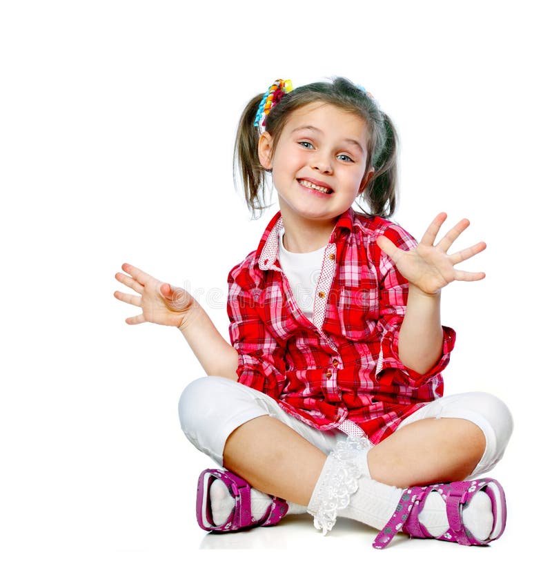 Portrait of a cheerful girl sitting on the floor