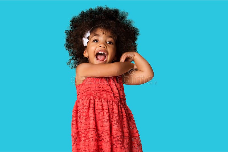 Portrait of cheerful happy african american little girl isolated over colored background