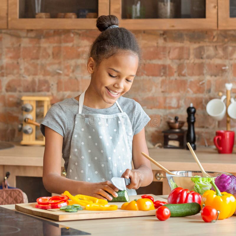Portrait of Cheerful Little Girl Cutting Vegetables Stock Photo - Image