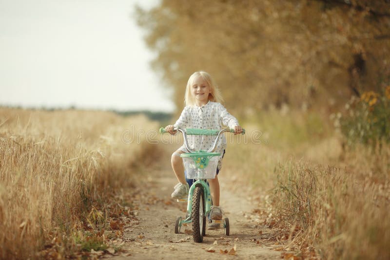 Portrait of a cheerful little girl at nature