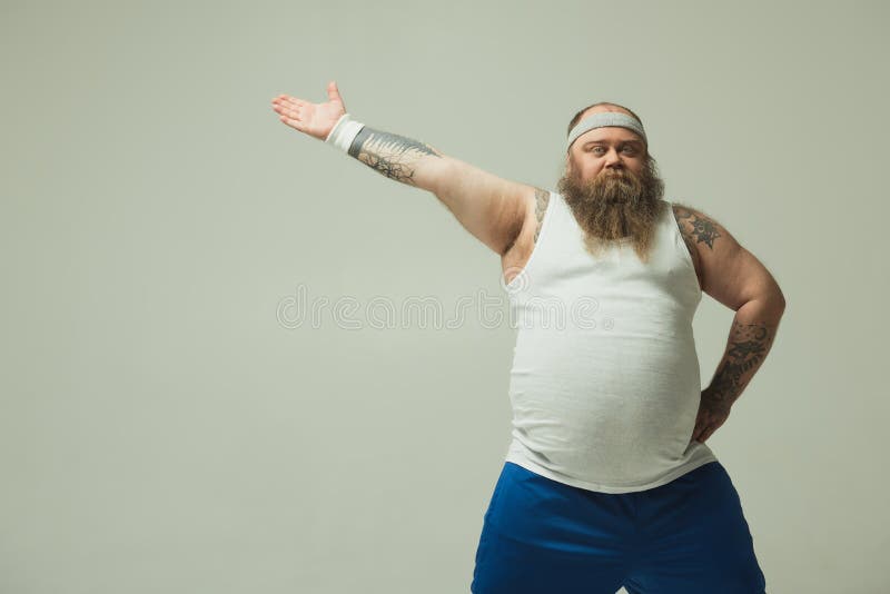 Confident fat man doing exercise royalty free stock images Confident fat man doing exercise royalty free stock images