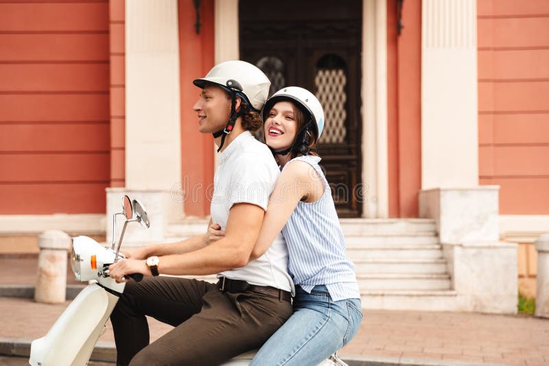 Portrait of a Cheerful Young Couple in Helmets Stock Image - Image of ...
