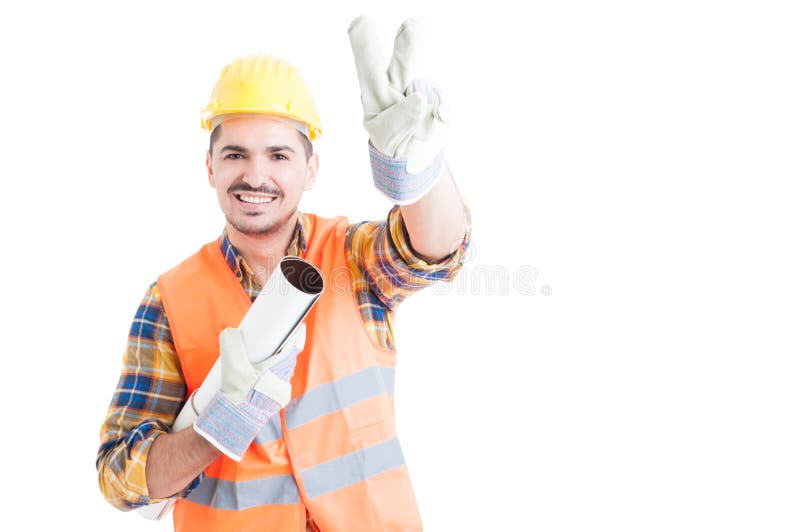 Portrait of cheerful young engineer making peace or victory gest