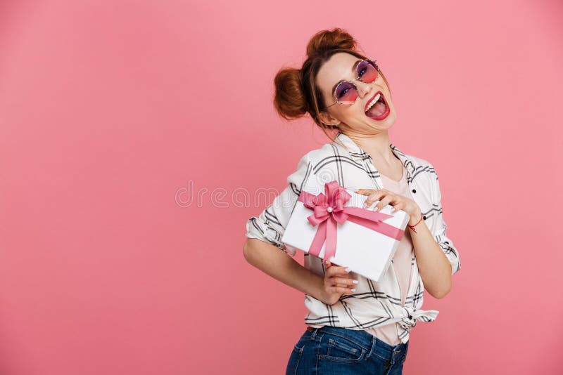 Portrait of a cheerful young girl in sunglasses