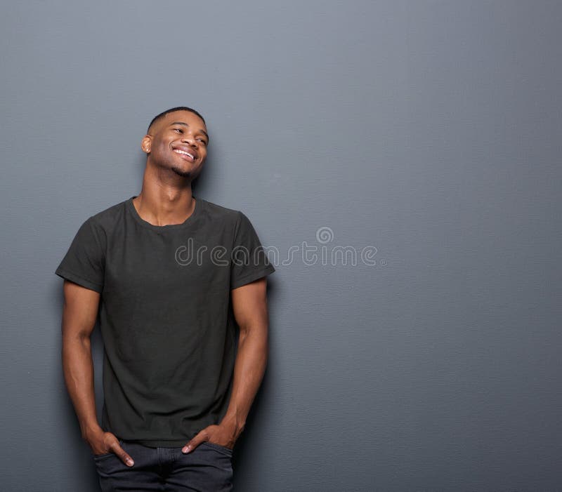 Portrait of a cheerful young man smiling royalty free stock images