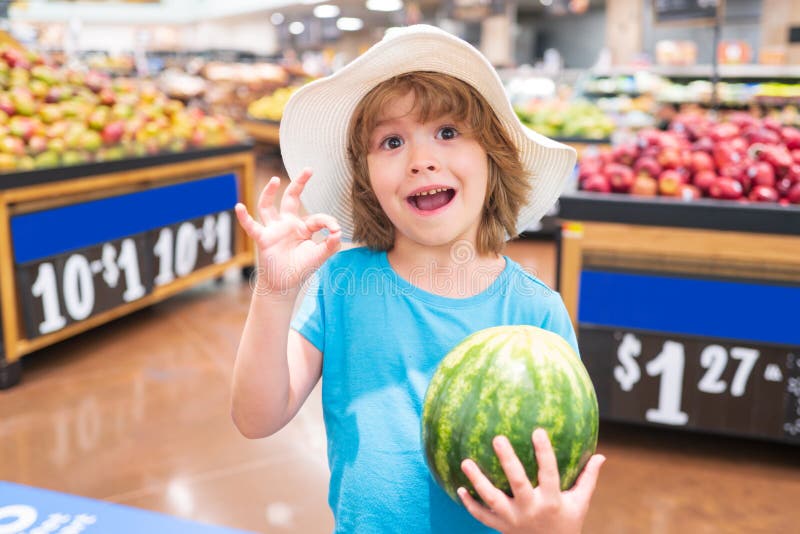 Portrait Of Child Hold Watermelon In Grocery Shopping In ...