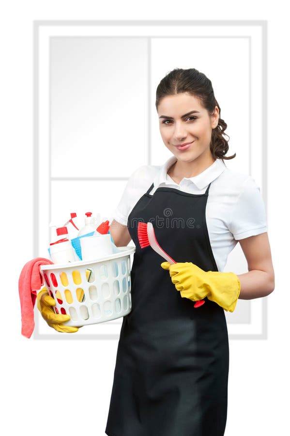 Woman holding basket with cleaning supplies Stock Photo by