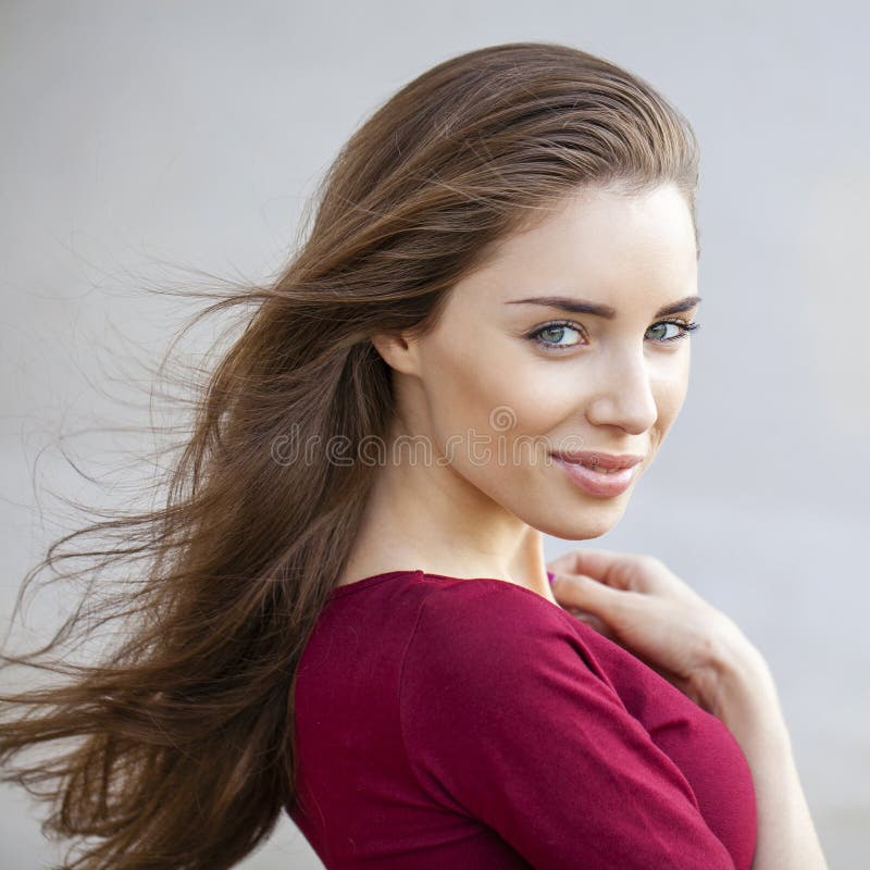 Portrait close up of young beautiful brunette woman