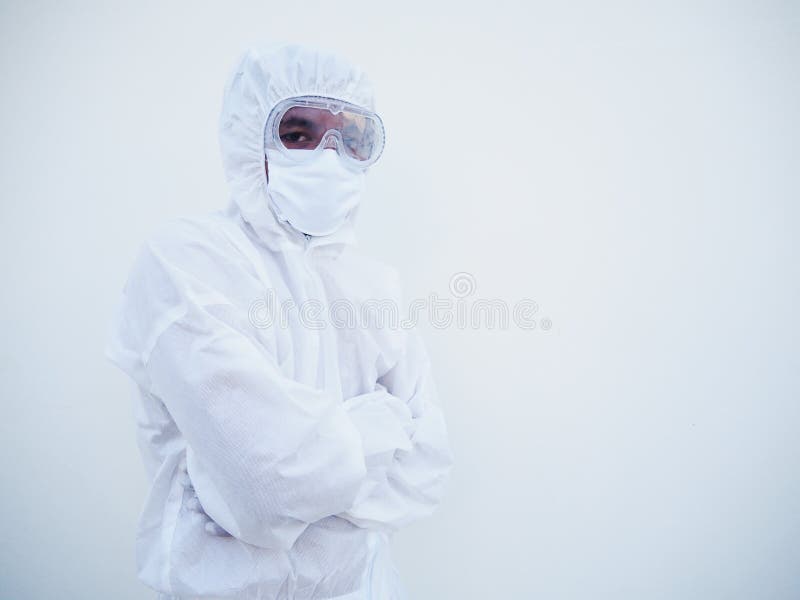 Portrait of confident asian male doctor or scientist in PPE suite uniform while folding his hands in the white background. Copy royalty free stock photo