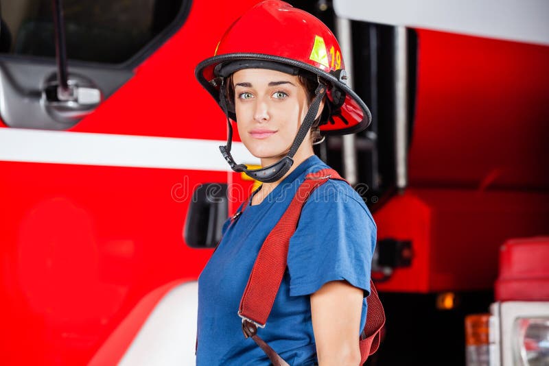 Confident Firewoman Standing At Fire Station Stock Image Image Of Helmet Department 69931151