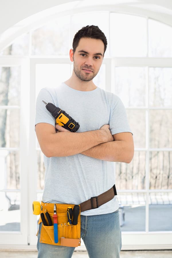 Man Holding Drill As Gun Against Wall Stock Photo Image of domestic