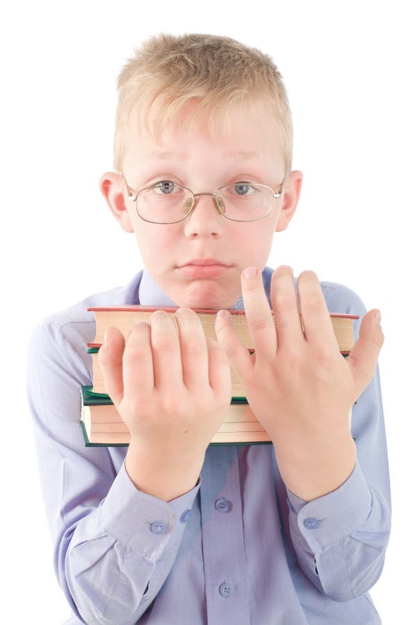 Portrait of confused boy holding three books