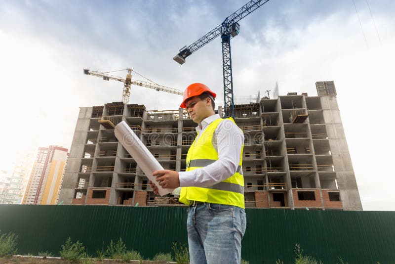 Portrait of Male Construction Engineer Standing on Building Site and ...