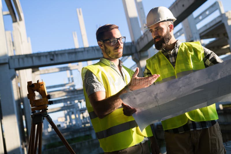 Portrait of construction engineers working on building site stock photography Portrait of construction engineers working on building site stock photography