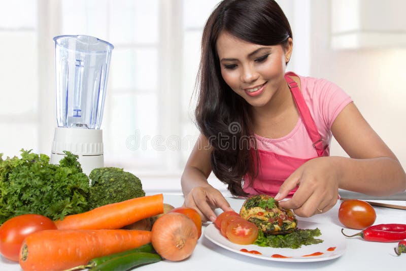 Portrait of Cooking woman in kitchen stock image Portrait of Cooking woman in kitchen stock image