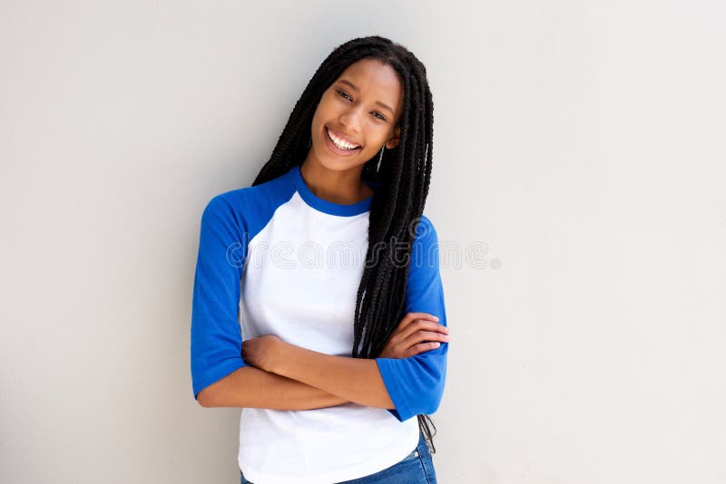 Cool young african girl standing with arms crossed