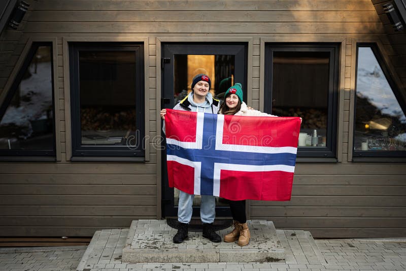 Portrait of Couple Outside Cabin House Holding Norway Flag ...