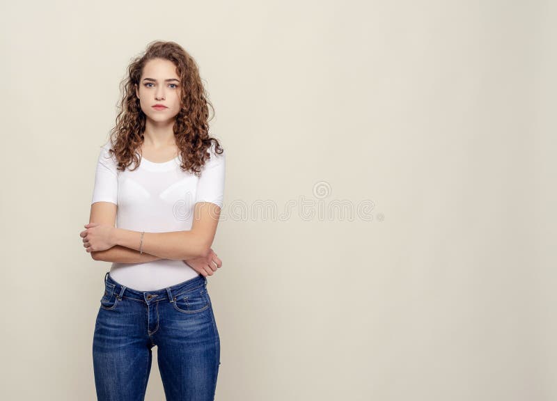 Portrait Curly-haired Girl in White T-shirt and Jeans Stock Image ...