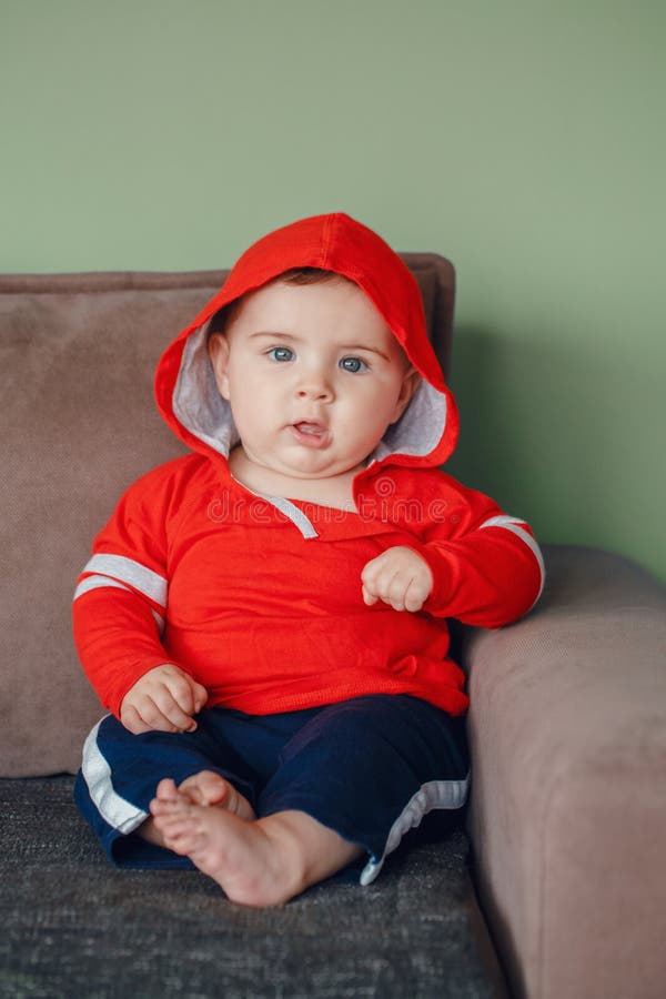 Baby Boy with Blue Eyes, Wearing Red Sport Hoodie Shirt and Tracksuit ...